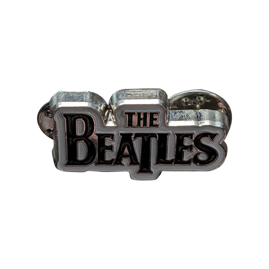 Een foto van een The Beatles Speld