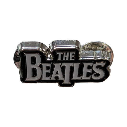 Een foto van een The Beatles Speld Badge