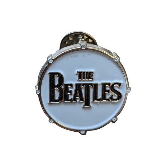 Een foto van een The Beatles Speld Badge